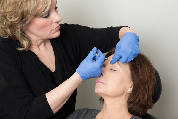 A patient receives Botox injections at Plastic Surgery Center of Nashville